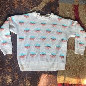 Tan sweater with peach designs